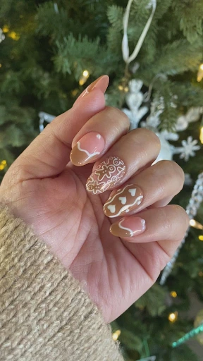 Image of a gingerbread friends & candy cane swirls nails