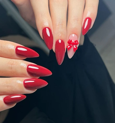 Image of the 3d sculpted red bow accent nails
