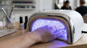 Gel polish curing under UV:LED light for better humidity resistance